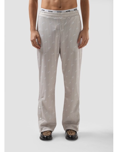 GCDS Pantaloni track gessati con logo all over